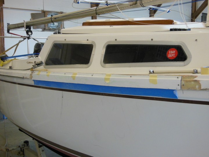 New molded panel screwed in place, ready for filling