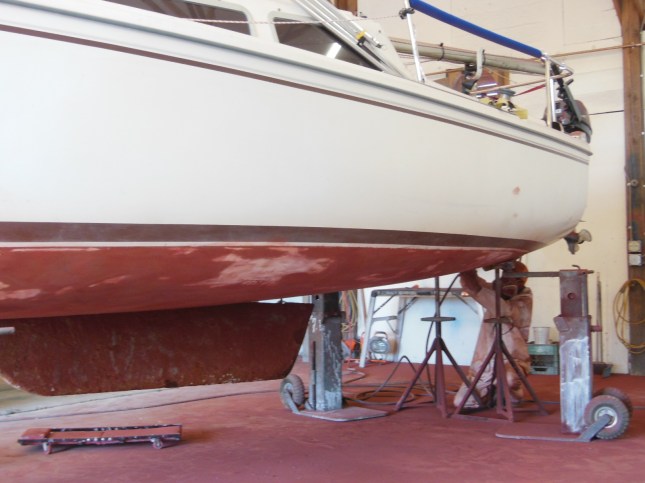 Removing the old paint is a grueling, dirty job