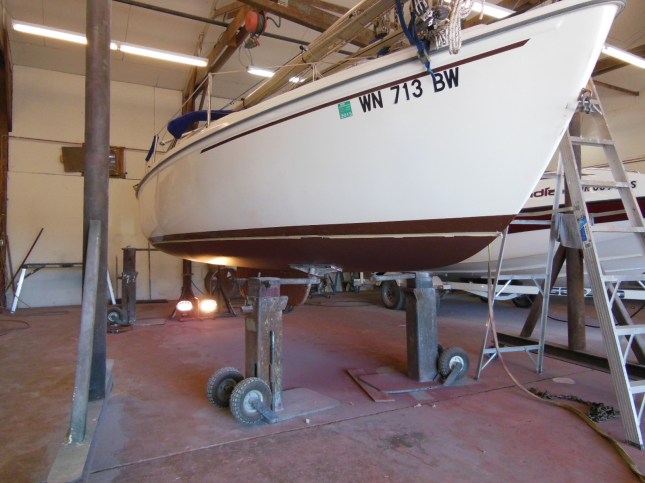 BEFORE - Brown cove stripe covered with a new patch of white gelcoat