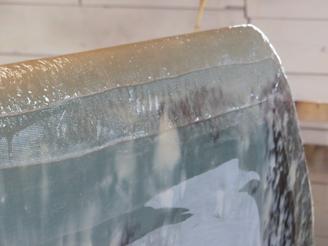 Two layers of fiberglass tape using three strips