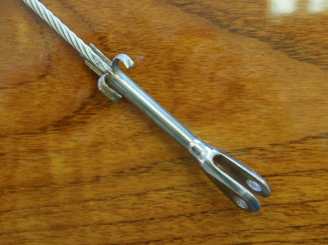 A stainless steel banana? No, a swaged fork terminal sheared open from not running on the correct side of the turning ball