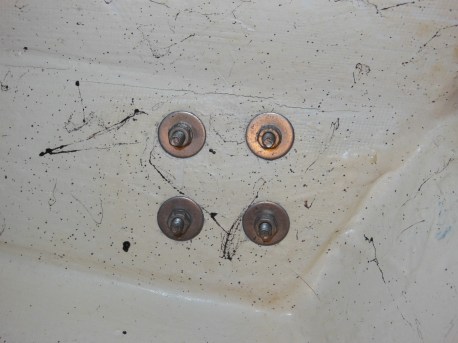 Winch fasteners on the underside of the coaming. Always use fender (oversize) washers